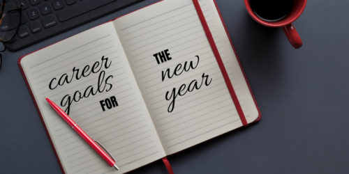 Notebook with red pen that says, 'careers goals for the new year.'